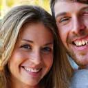 Portrait of a smiling couple, Amelia and Ben.